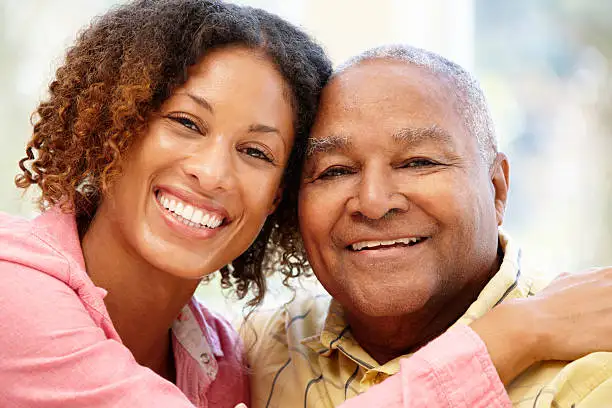 Photo of a senior couple hugging each other.